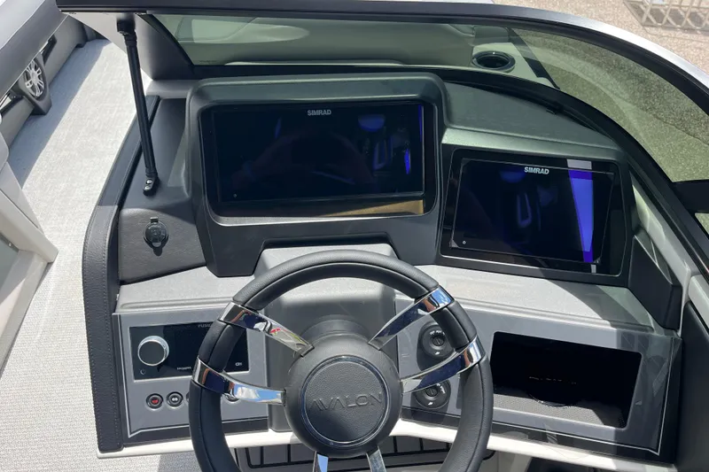 Slide: The Image of Steering console of 2026 Avalon 2785 Excalibur LTD with dual Simrad displays. - 12