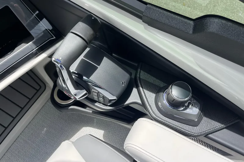 Slide: The Image of Control panel of 2026 Avalon 2785 Excalibur LTD boat with joystick and throttle. - 13