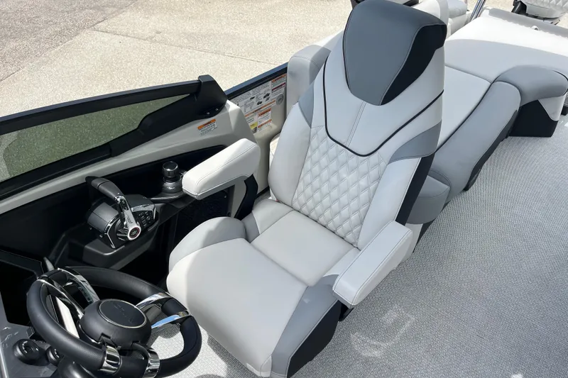 Slide: The Image of Luxurious seating and controls of 2026 Avalon 2785 Excalibur LTD boat. - 19