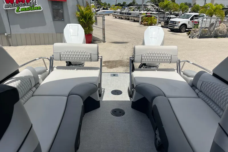 Slide: The Image of 2026 Avalon 2785 Excalibur LTD boat with luxurious quad lounger seating and twin Mercury engines. - 21