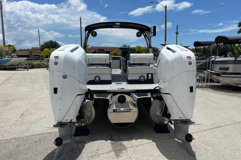 Slide: The Image of 2026 Avalon 2785 Excalibur LTD boat with twin Mercury 400hp V-10 engines, rear view. - 6