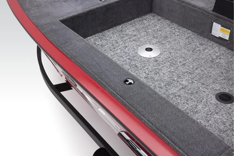Slide: The Image of Manufacturer Provided Image: 2025 Tracker Super Guide V-16 T boat interior with gray carpet and red trim. - 16