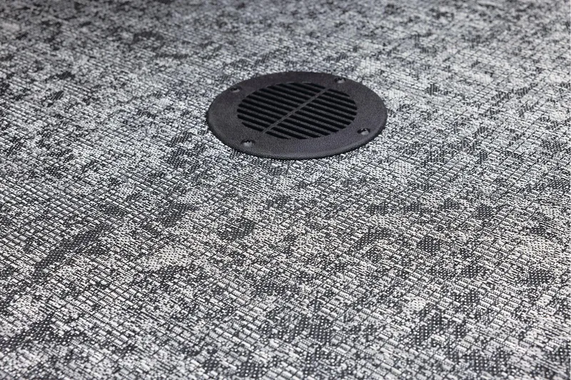 Slide: The Image of Manufacturer Provided Image: Carpeted floor with a circular vent in a 2025 Tracker Super Guide V-16 T boat. - 18