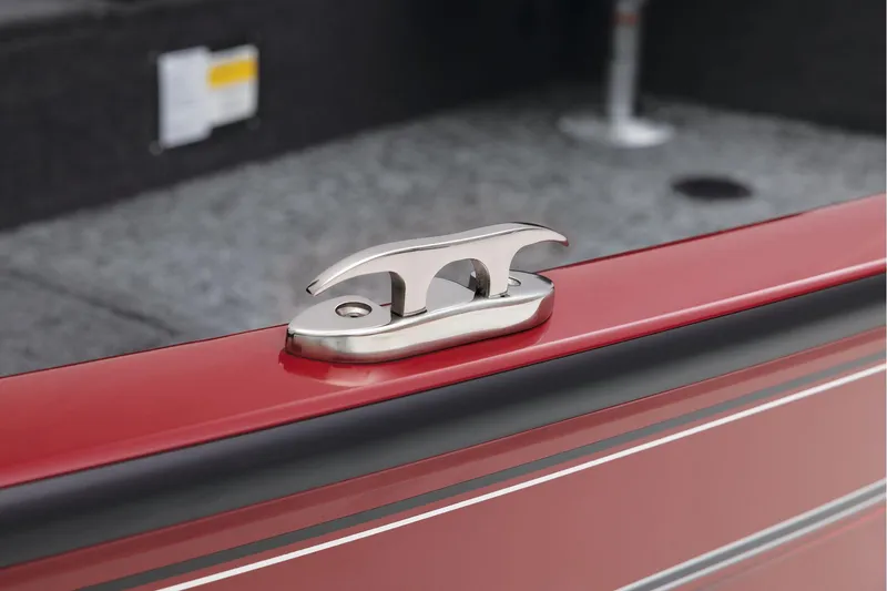 Slide: The Image of Manufacturer Provided Image: 2025 Tracker Super Guide V-16 T boat cleat on red deck, close-up view. - 21