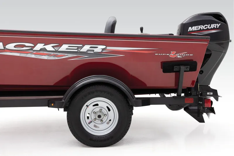 Slide: The Image of Manufacturer Provided Image: 2025 Tracker Super Guide V-16 T boat, red exterior, Mercury engine, trailer wheel visible. - 23