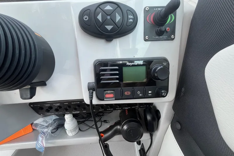 Slide: The Image of Control panel of 2020 Rinker 290 EX boat with Raymarine equipment and joystick. - 15