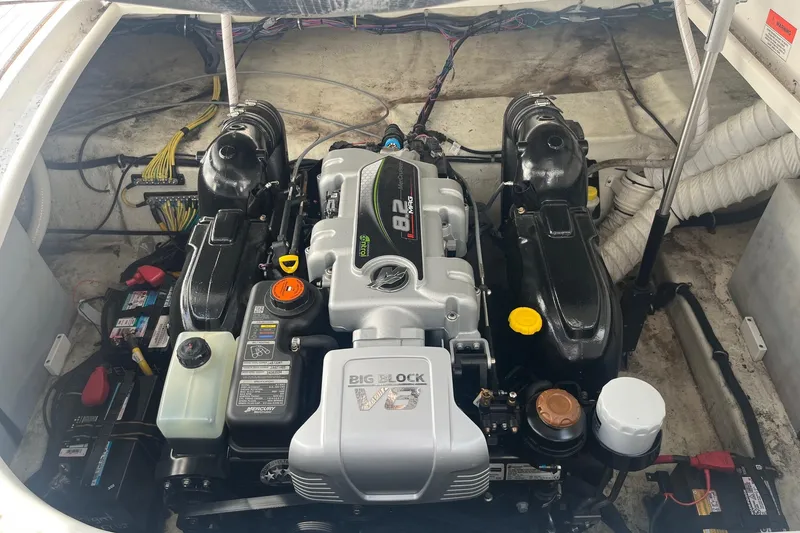 Slide: The Image of 2020 Rinker 290 EX boat engine compartment with Big Block V8 engine. - 26