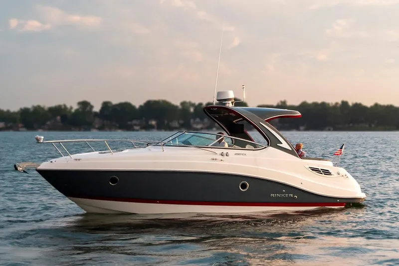 Slide: The Image of Manufacturer Provided Image: 2020 Rinker 290 EX boat cruising on a calm lake. - 28