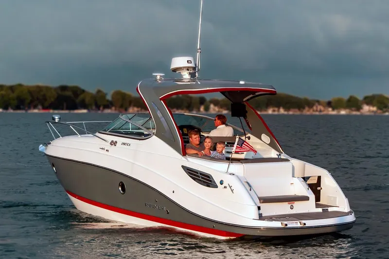Slide: The Image of Manufacturer Provided Image: 2020 Rinker 290 EX boat cruising on a lake with passengers. - 31