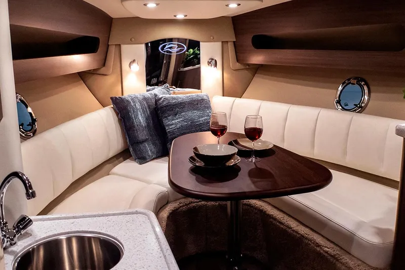 Slide: The Image of Manufacturer Provided Image: Luxurious interior of 2020 Rinker 290 EX boat with cozy seating and dining area. - 34