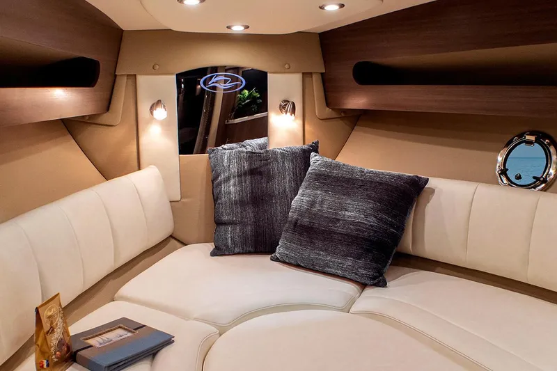 Slide: The Image of Manufacturer Provided Image: Luxurious interior cabin of 2020 Rinker 290 EX boat with plush seating and ambient lighting. - 35