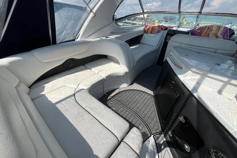 Slide: The Image of 2020 Rinker 290 EX boat interior with white seating and modern design. - 5