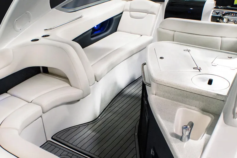Slide: The Image of Manufacturer Provided Image: 2020 Rinker 290 EX boat interior with white leather seating and modern amenities. - 9