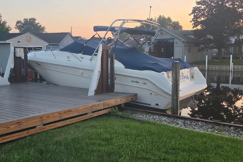 Slide: The Image of 1991 Sea Ray 300 Weekender docked at sunset, covered and ready for use. - 1