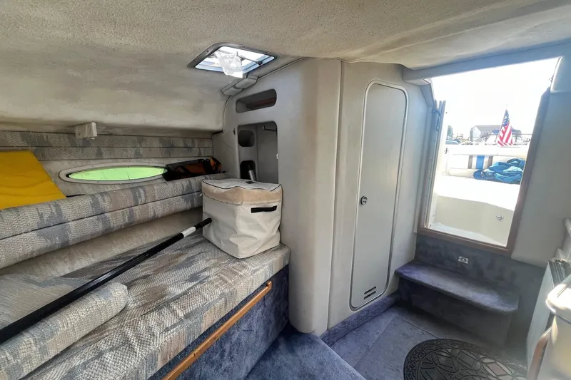 Slide: The Image of Interior of 1991 Sea Ray 300 Weekender boat with seating and storage. - 13