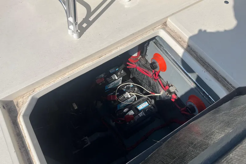 Slide: The Image of Battery compartment of a 1991 Sea Ray 300 Weekender boat, showing wiring and connections. - 24