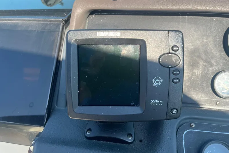 Slide: The Image of Humminbird 596c HD sonar device on 1991 Sea Ray 300 Weekender boat dashboard. - 8