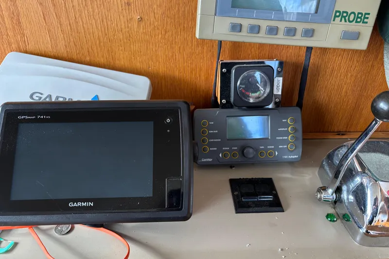 Slide: The Image of Control panel of a 1985 Mainship 34 III with Garmin GPS and navigation instruments. - 16