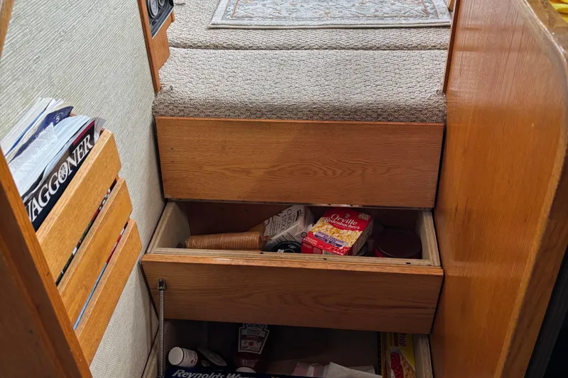 Slide: The Image of Interior of 1985 Mainship 34 III with storage drawers and magazines. - 22