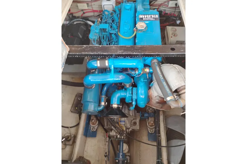 Slide: The Image of Engine compartment of a 1985 Mainship 34 Mk III with blue components. - 39