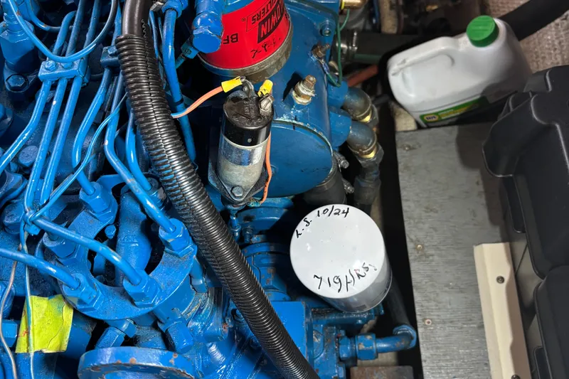 Slide: The Image of Engine compartment of a 1985 Mainship 34 III with visible components and wiring. - 42