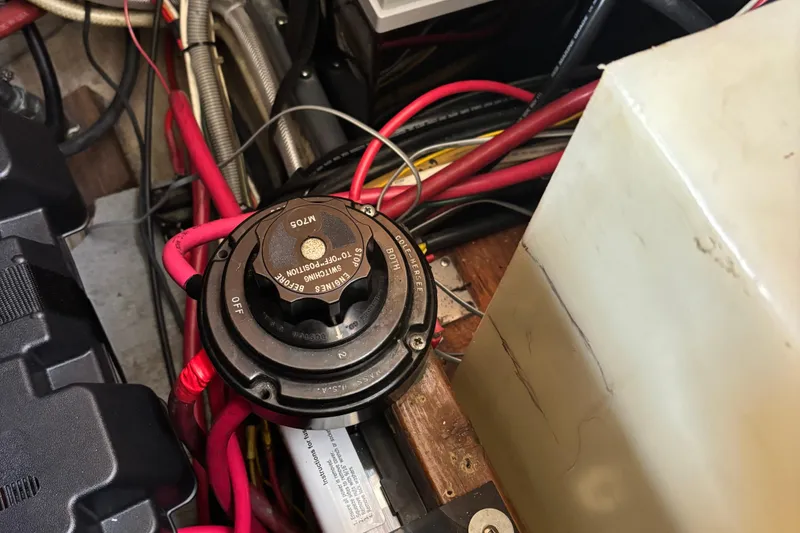 Slide: The Image of Battery switch and wiring in a 1985 Mainship 34 III boat engine compartment. - 45