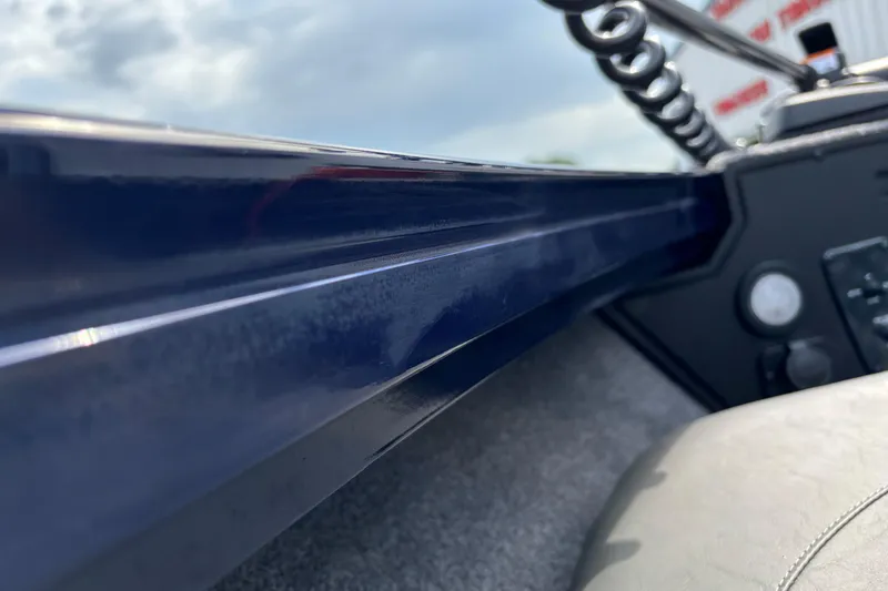 Slide: The Image of Close-up of 2025 Tracker Targa V-18 Combo boat interior, highlighting sleek design and controls. - 2