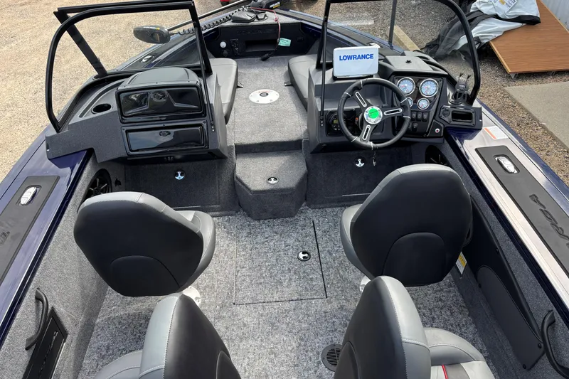 Slide: The Image of 2025 Tracker Targa V-18 Combo boat interior with steering wheel and seating. - 3