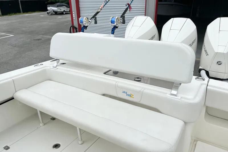 Slide: The Image of 2021 SeaVee 340Z boat with white seating and Mercury outboard engines. - 11