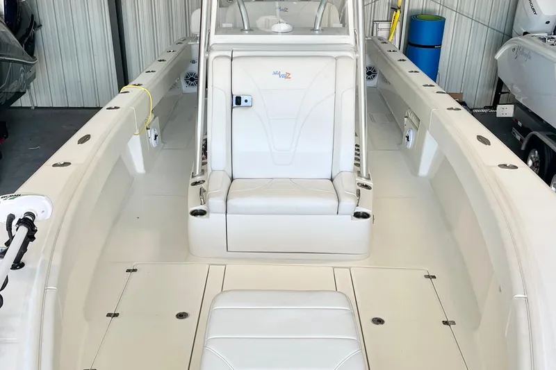 Slide: The Image of 2021 SeaVee 340Z boat interior with white seating and spacious deck. - 14