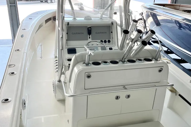 Slide: The Image of 2021 SeaVee 340Z boat interior with Garmin navigation system and rod holders. - 15