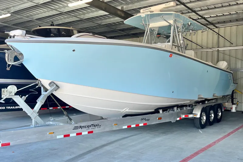 Slide: The Image of 2021 SeaVee 340Z boat on trailer in storage facility. - 8
