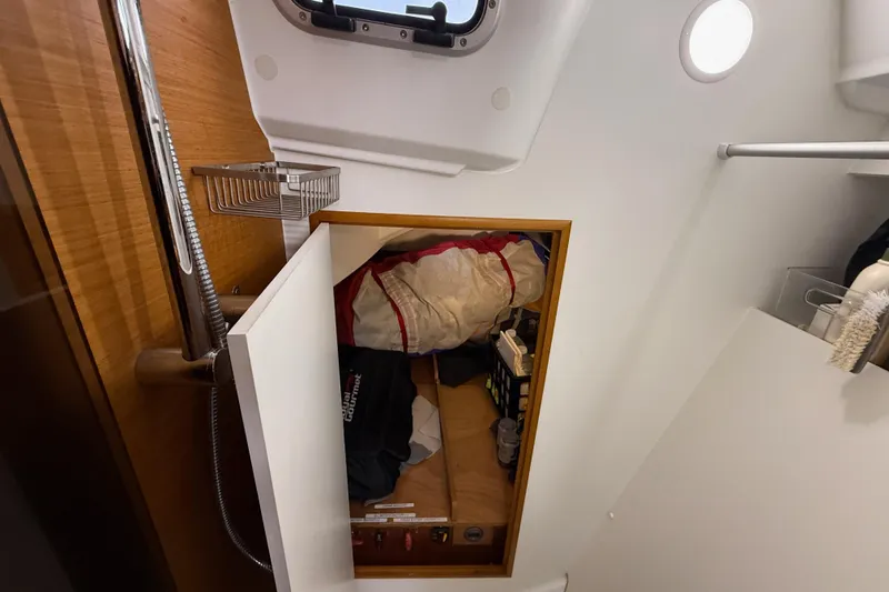 Slide: The Image of Interior storage of 2016 Jeanneau Sun Odyssey 349 sailboat, featuring organized compartments. - 21