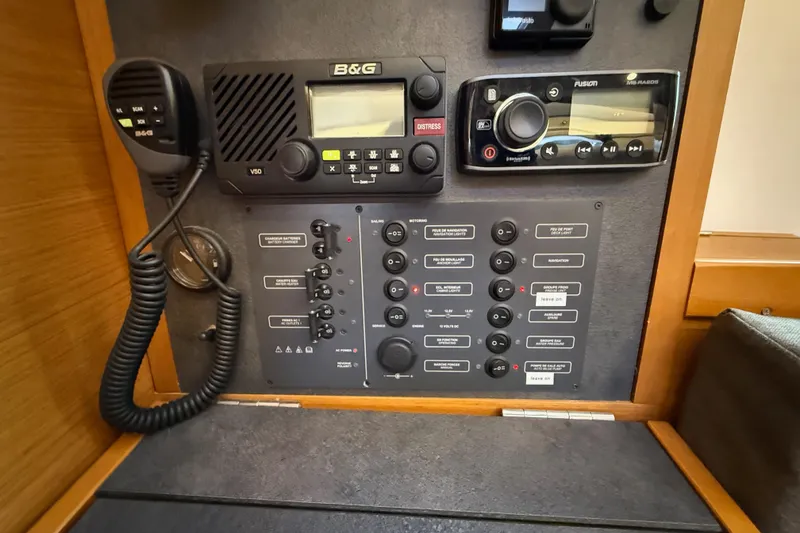 Slide: The Image of Control panel of a 2016 Jeanneau Sun Odyssey 349 sailboat, featuring communication and navigation equipment. - 24