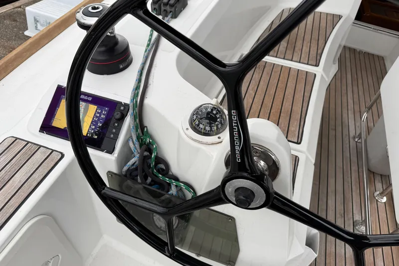 Slide: The Image of Steering wheel and navigation equipment on 2016 Jeanneau Sun Odyssey 349 sailboat. - 26
