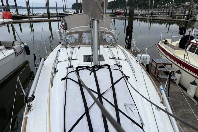 Slide: The Image of 2016 Jeanneau Sun Odyssey 349 sailboat docked at a marina, view from the deck. - 30