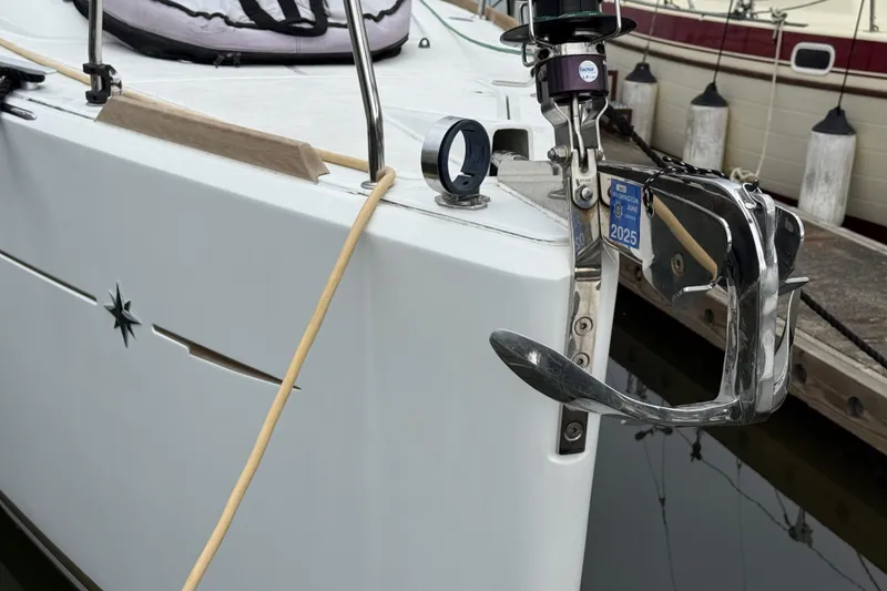 Slide: The Image of 2016 Jeanneau Sun Odyssey 349 sailboat with anchor and docked in marina. - 33