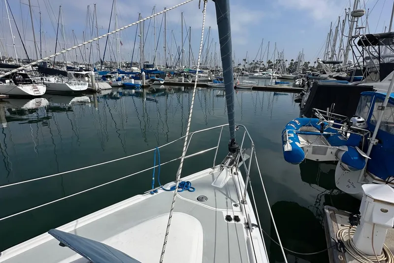 Slide: The Image of Sailboat docked in marina, Hunter 36 model, 2008, surrounded by other boats. - 13