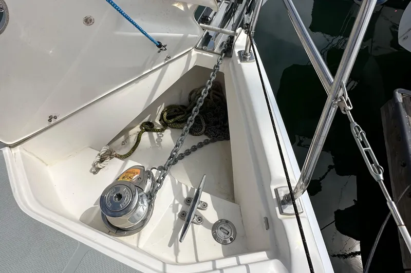 Slide: The Image of Anchor locker of a 2008 Hunter 36 sailboat with chain and windlass. - 15
