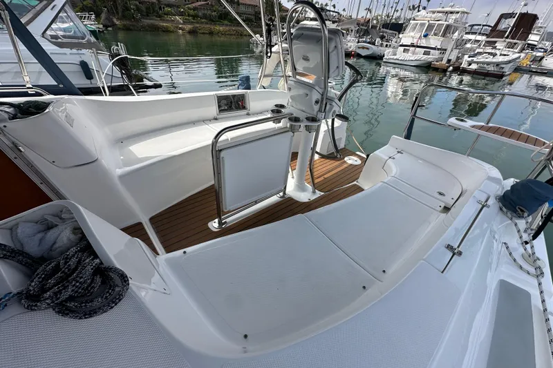 Slide: The Image of 2008 Hunter 36 sailboat cockpit with seating and steering wheel in marina. - 24