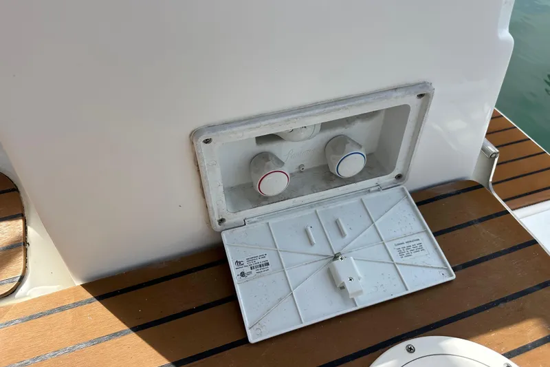 Slide: The Image of Outdoor shower controls on a 2008 Hunter 36 sailboat deck. - 27