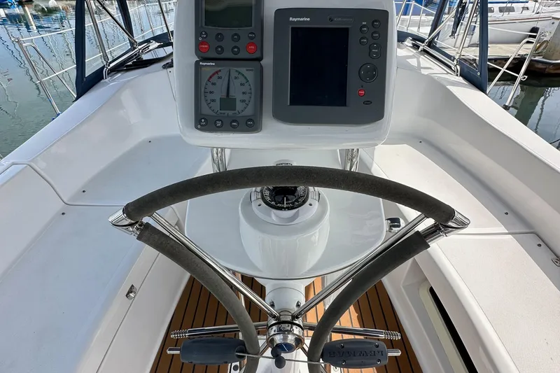 Slide: The Image of Steering wheel and navigation instruments on a 2008 Hunter 36 sailboat cockpit. - 31