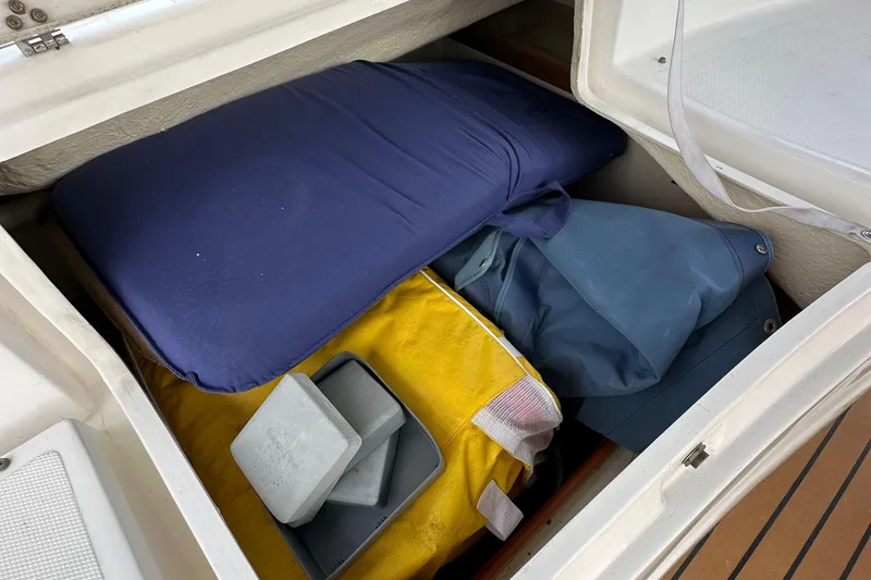 Slide: The Image of Storage compartment on a 2008 Hunter 36 sailboat with cushions and gear. - 32