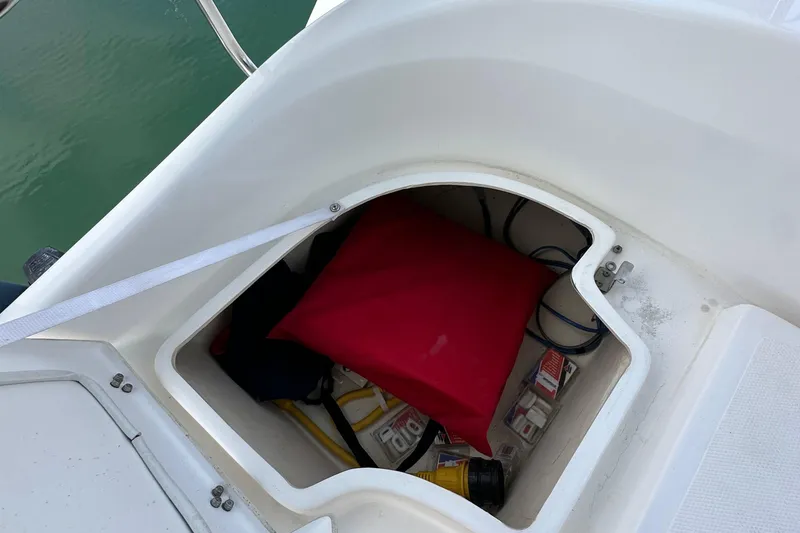 Slide: The Image of Storage compartment on a 2008 Hunter 36 sailboat, containing safety equipment and supplies. - 33