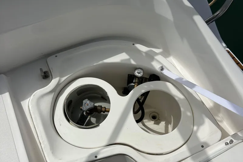 Slide: The Image of Gas compartment on a 2008 Hunter 36 sailboat, featuring dual storage spaces. - 34