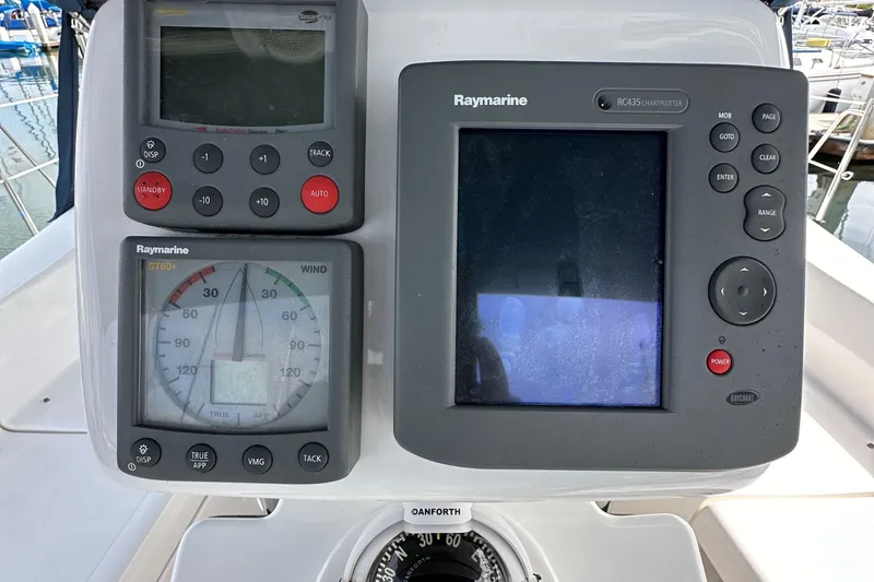 Slide: The Image of Raymarine navigation instruments on a 2008 Hunter 36 sailboat dashboard. - 37