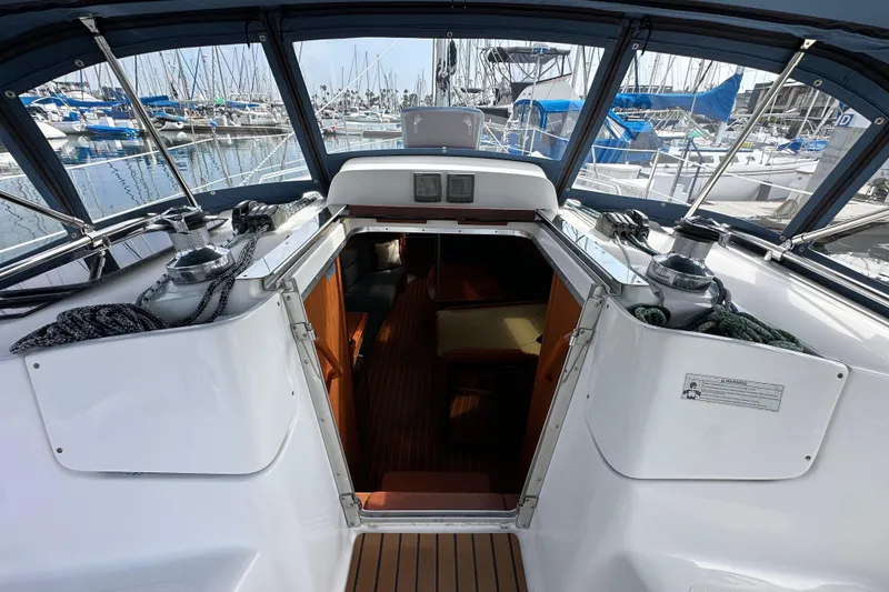 Slide: The Image of Cockpit view of 2008 Hunter 36 sailboat docked at marina, showing interior entrance. - 39