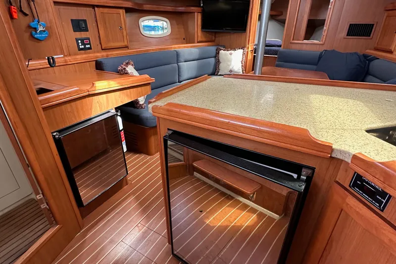 Slide: The Image of Interior of 2008 Hunter 36 sailboat with wood finish and modern amenities. - 49