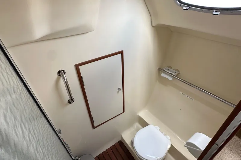 Slide: The Image of Compact bathroom in 2008 Hunter 36 sailboat with toilet and handrail. - 58