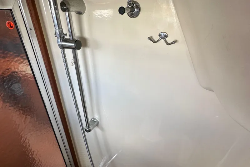 Slide: The Image of Shower area in a 2008 Hunter 36 boat with chrome fixtures. - 62